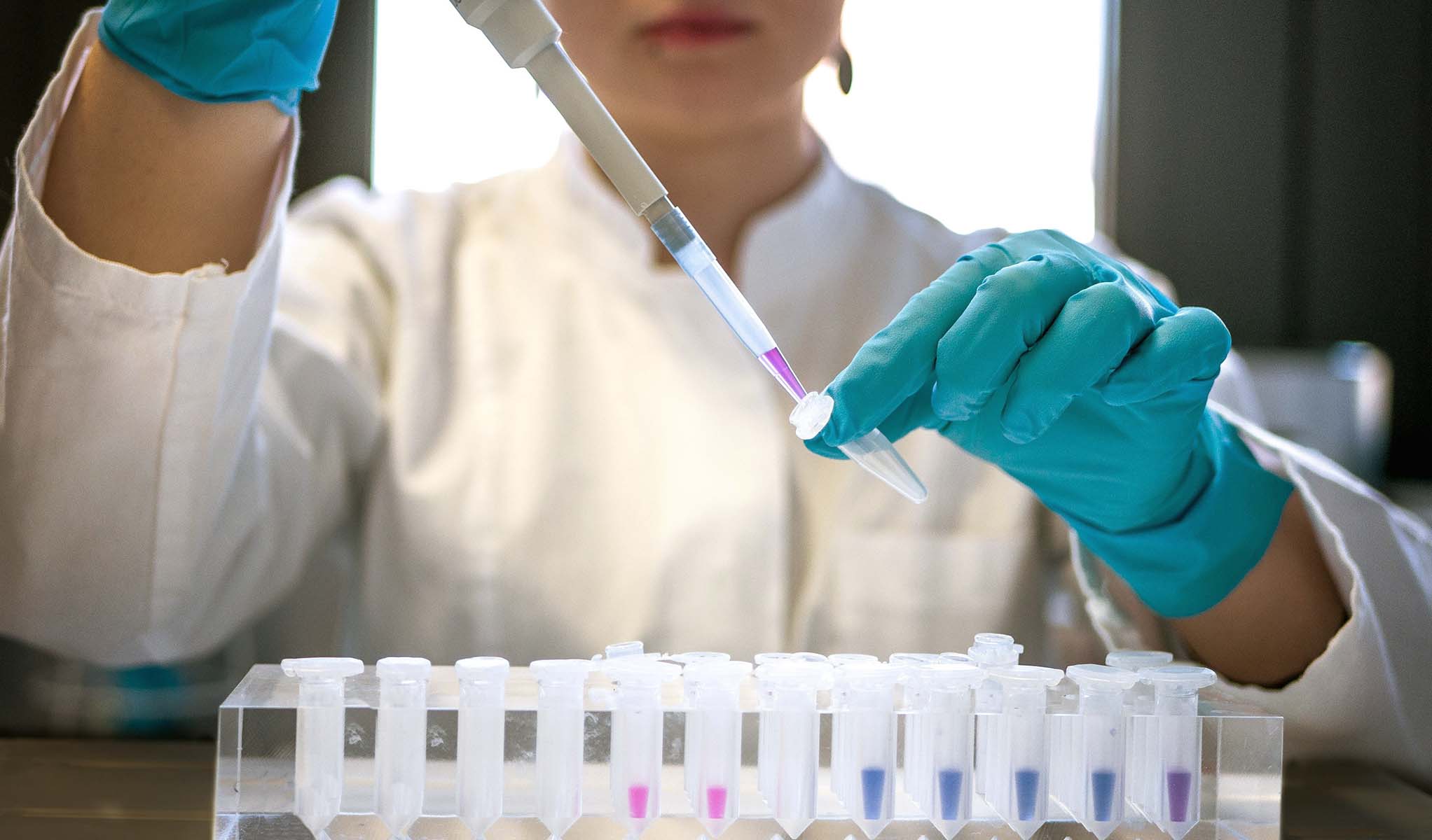cinclus pharma female scientist working with pipette in lab